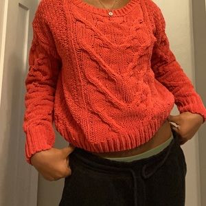 red/orange sweater